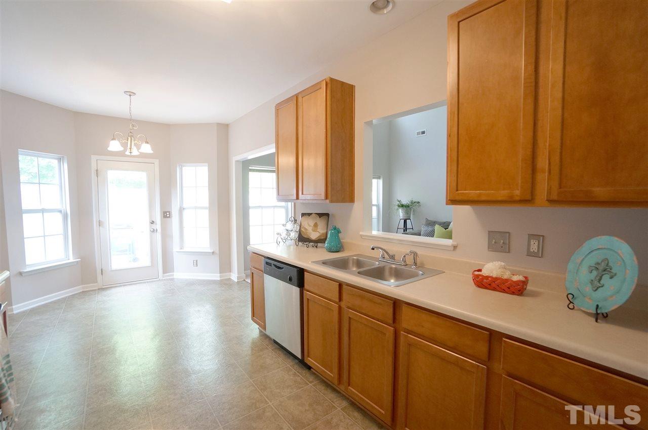 5109 Chasteal Trail Raleigh, NC 27610 - Photo 5 of 25 Bright & spacious kitchen has ample cabinets for added storage & open design for fluid traffic flow.