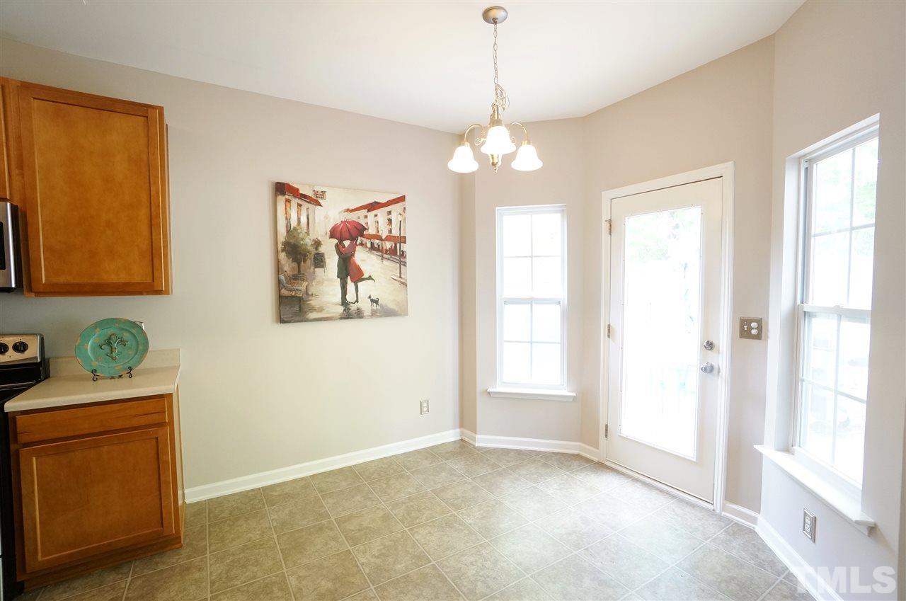 5109 Chasteal Trail Raleigh, NC 27610 - Photo 6 of 25 Breakfast area has a lovely view to the privacy fenced back yard.