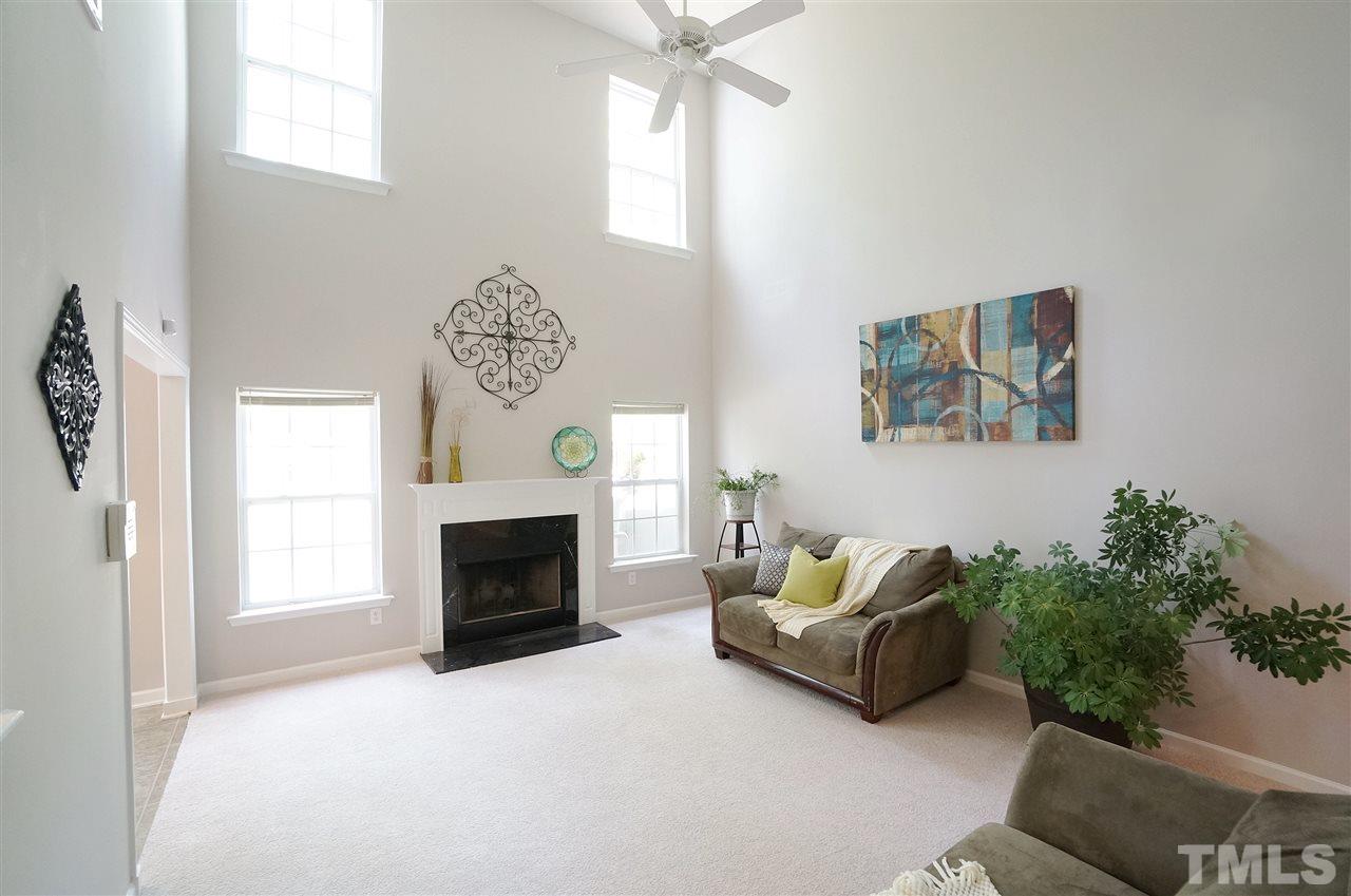 5109 Chasteal Trail Raleigh, NC 27610 - Photo 10 of 25 Second story ceiling and windows lend to the bright, open & inviting feel of this room.