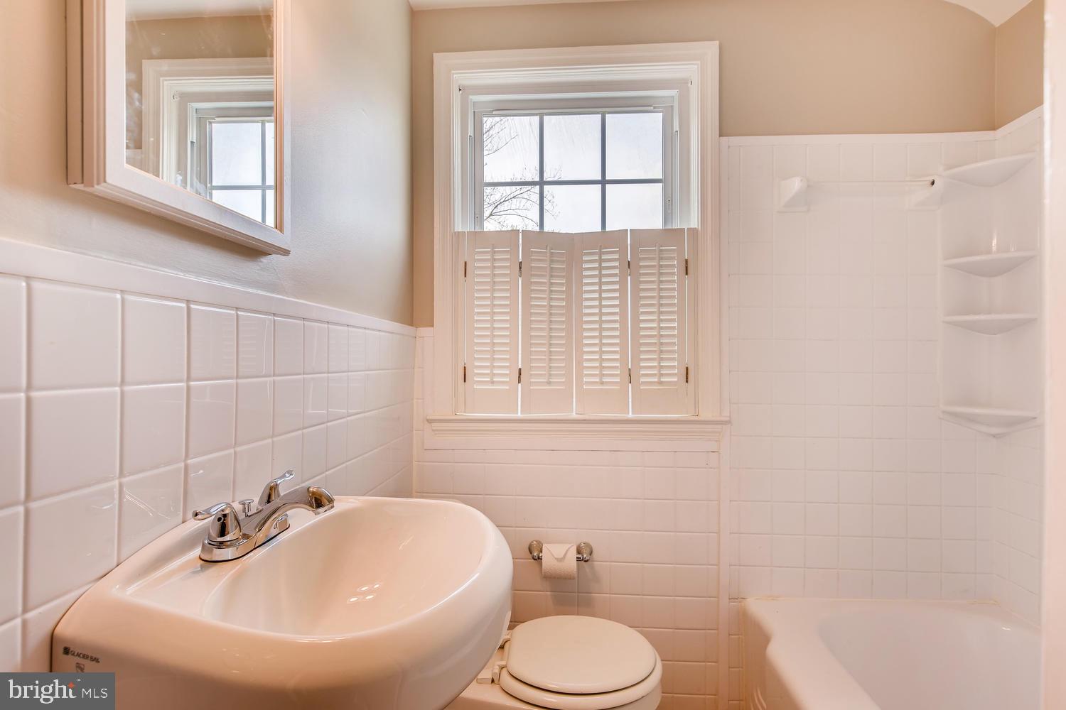 1618 Hardwick Road Baltimore, MD 21286 - Photo 15 of 27 a bathroom with a sink a toilet and shower