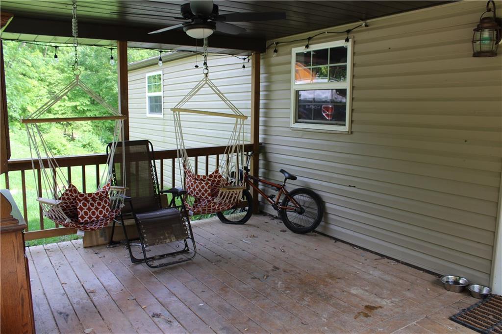 360 Narigon Run Road Claysville, PA 15323 - Photo 9 of 21 Imagine relaxing on the front porch swings.
