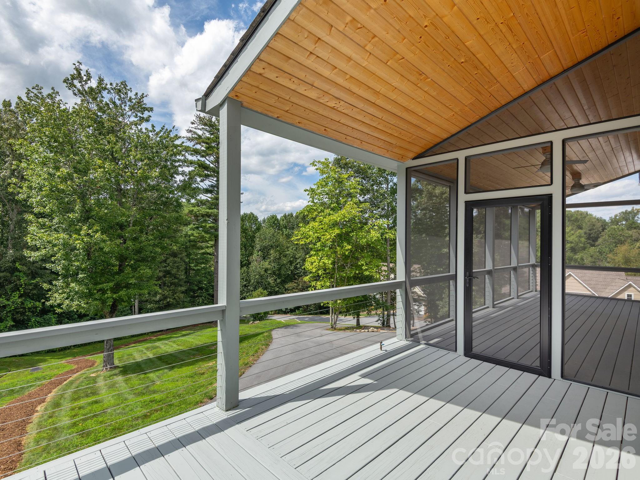 248 Wisdom Cove Road Flat Rock, NC 28731 - Photo 13 of 48 a view of balcony with floor to ceiling window wooden floor