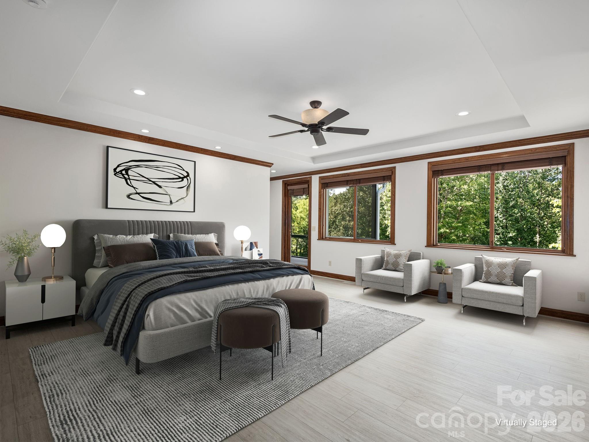 248 Wisdom Cove Road Flat Rock, NC 28731 - Photo 14 of 48 a spacious bedroom with a large bed and a couch