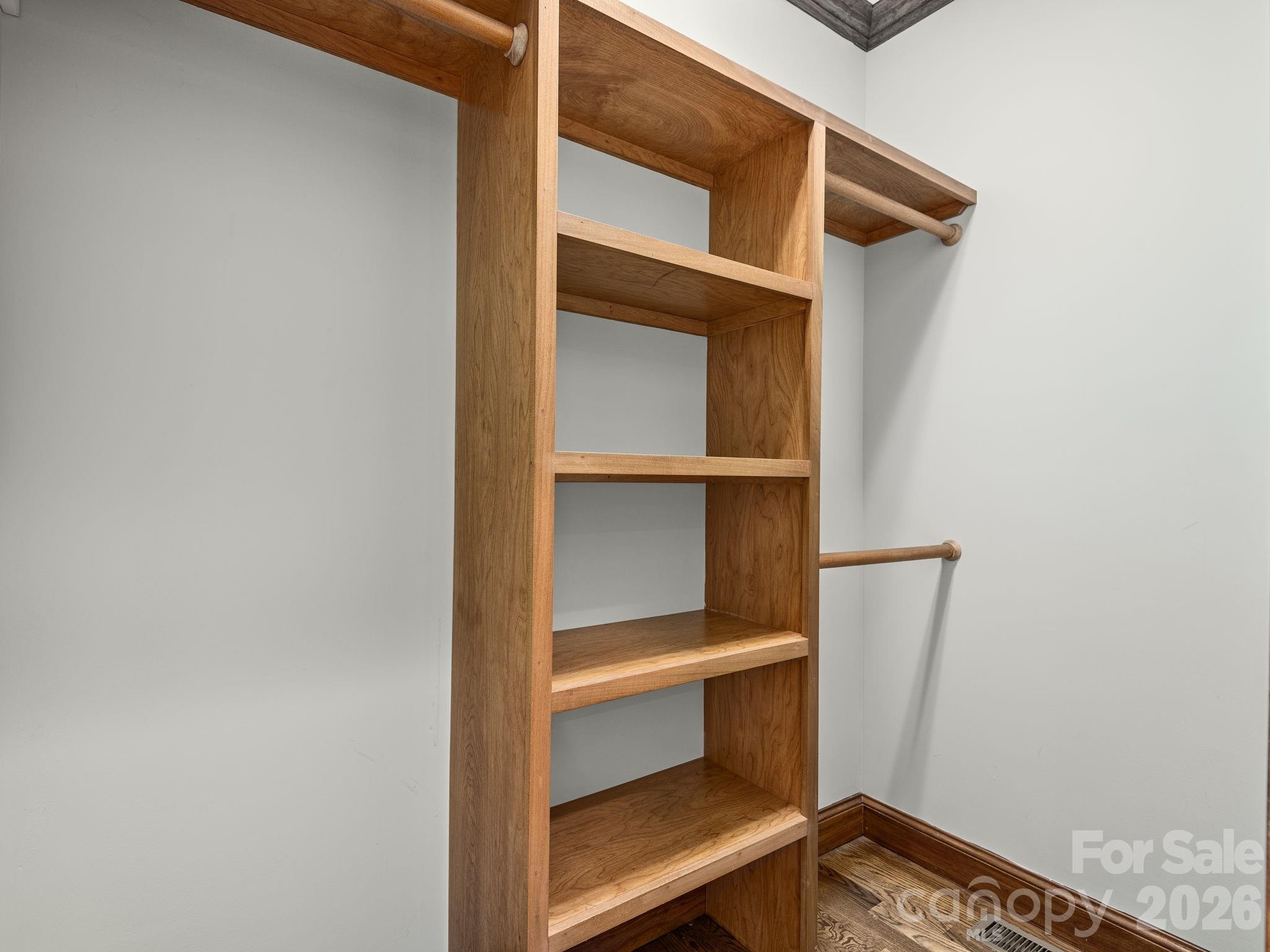 248 Wisdom Cove Road Flat Rock, NC 28731 - Photo 19 of 48 a view of walk in closet with empty racks