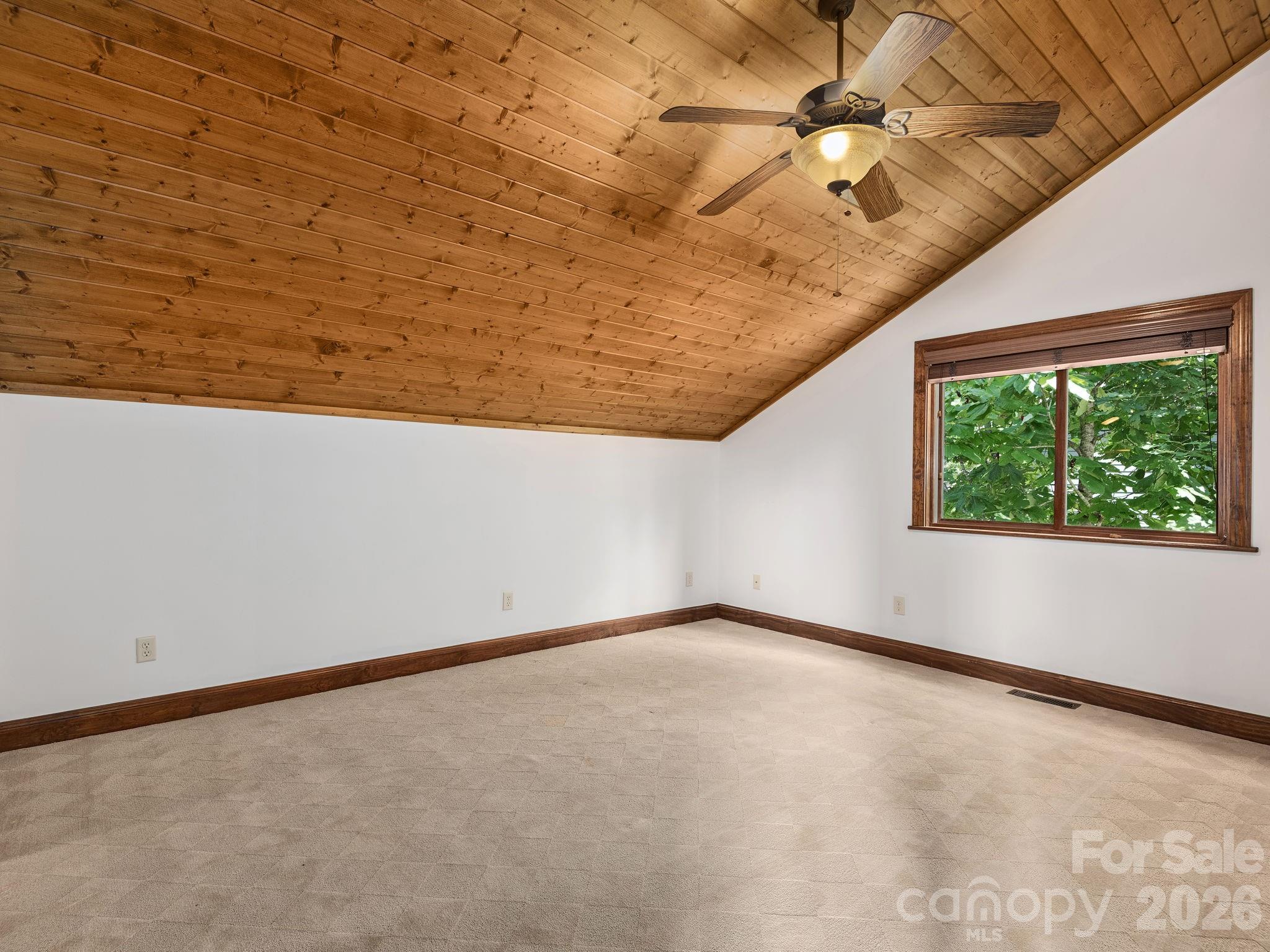 248 Wisdom Cove Road Flat Rock, NC 28731 - Photo 27 of 48 a view of an empty room with a window