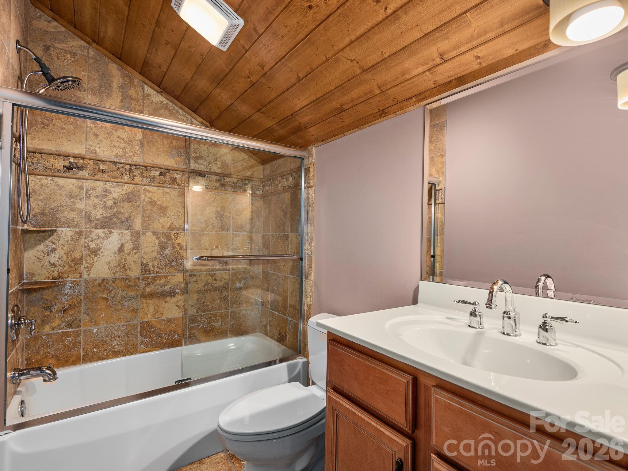 248 Wisdom Cove Road Flat Rock, NC 28731 - Photo 28 of 48 a bathroom with a sink shower bathtub and toilet