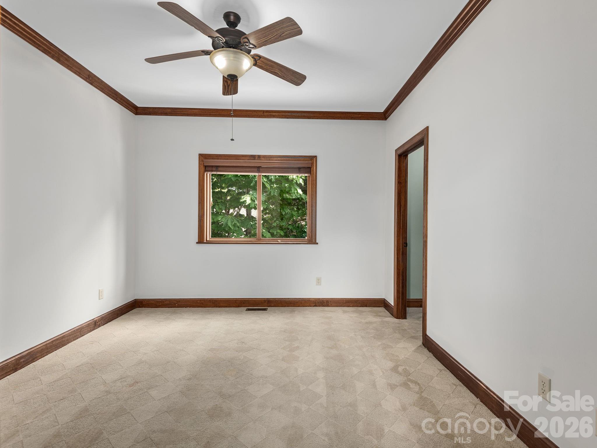 248 Wisdom Cove Road Flat Rock, NC 28731 - Photo 29 of 48 an empty room with a window and a ceiling fan