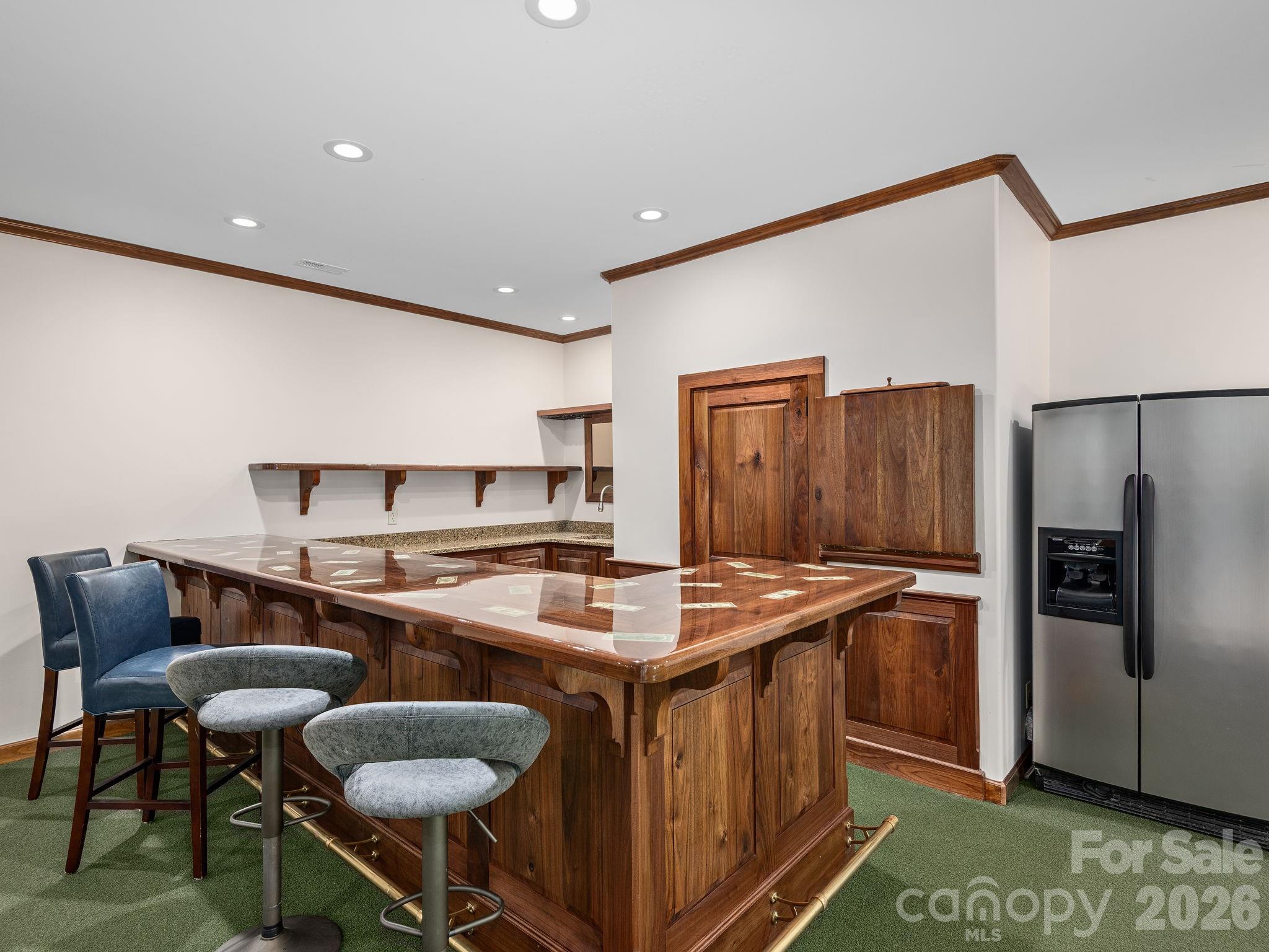 248 Wisdom Cove Road Flat Rock, NC 28731 - Photo 35 of 48 a kitchen with stainless steel appliances granite countertop a stove a refrigerator and a dining table