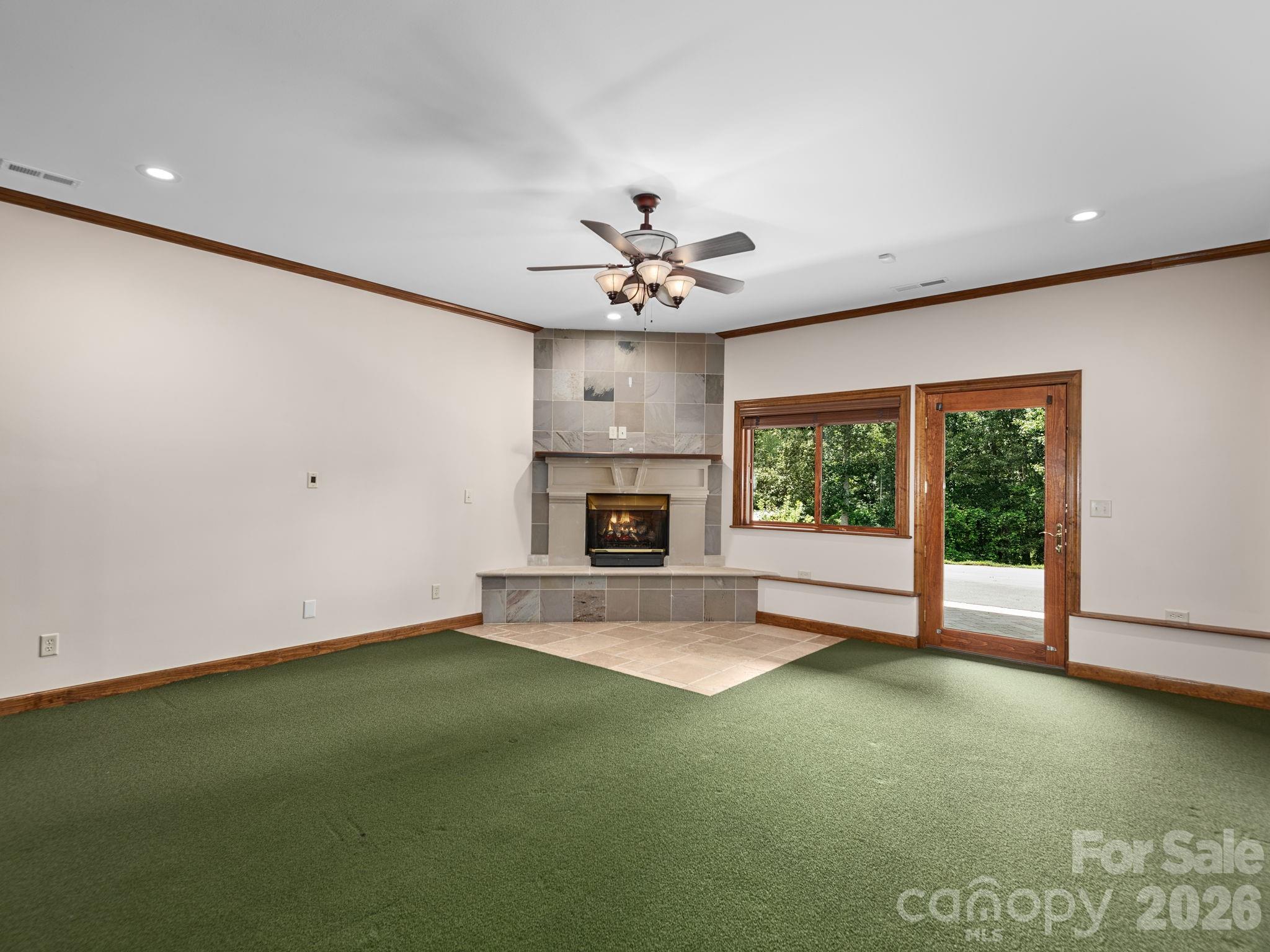 248 Wisdom Cove Road Flat Rock, NC 28731 - Photo 40 of 48 a view of an empty room with a fireplace
