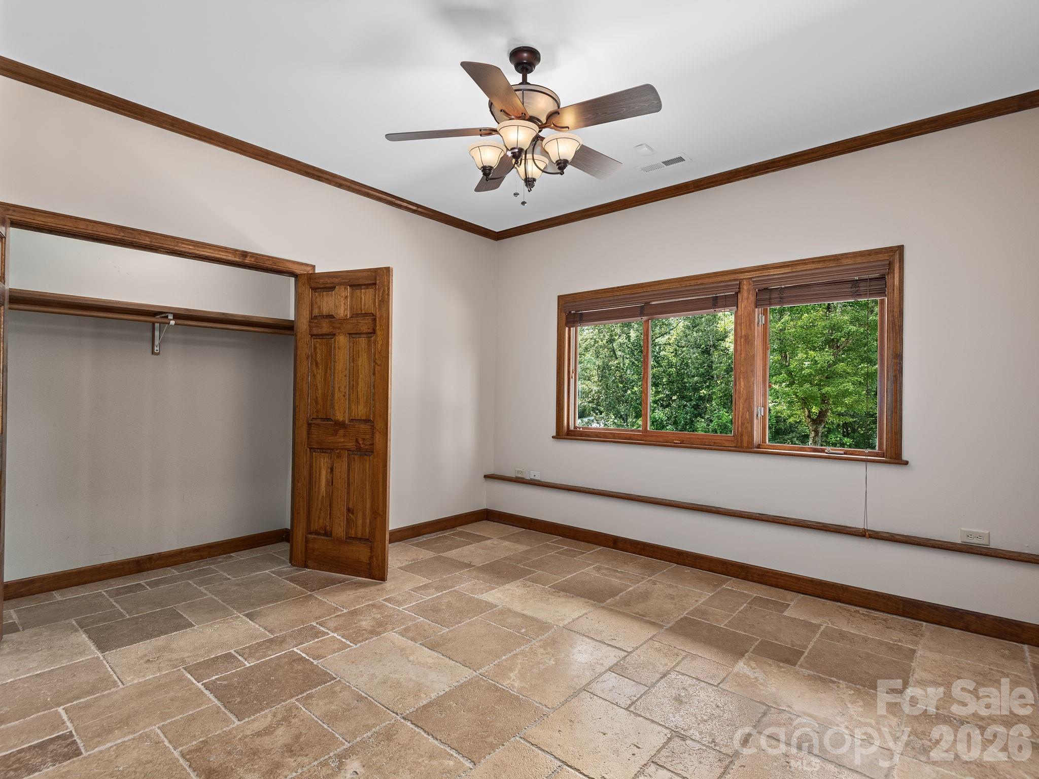 248 Wisdom Cove Road Flat Rock, NC 28731 - Photo 42 of 48 a view of a livingroom with a ceiling fan and window