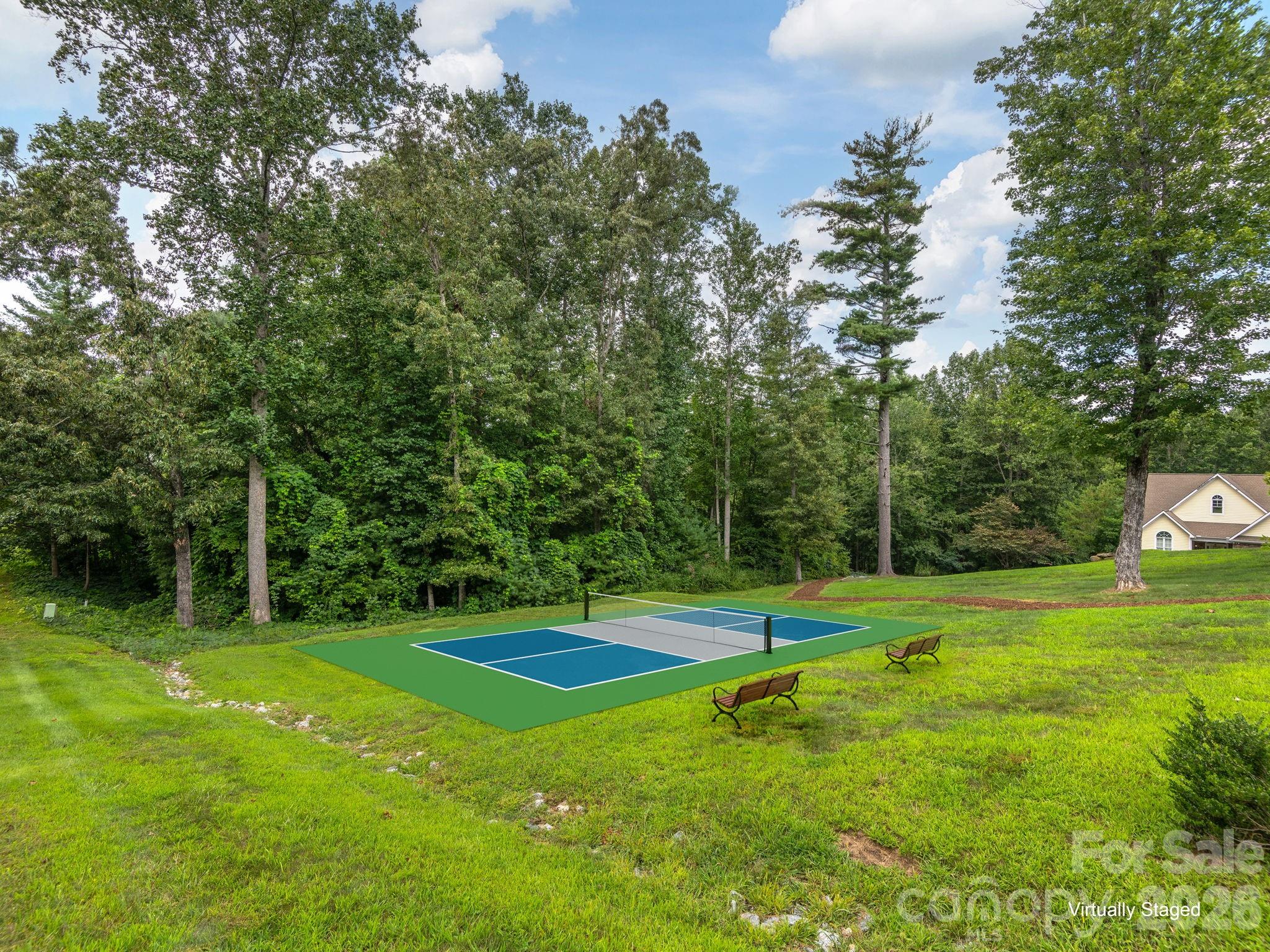 248 Wisdom Cove Road Flat Rock, NC 28731 - Photo 45 of 48 a view of a park with large trees