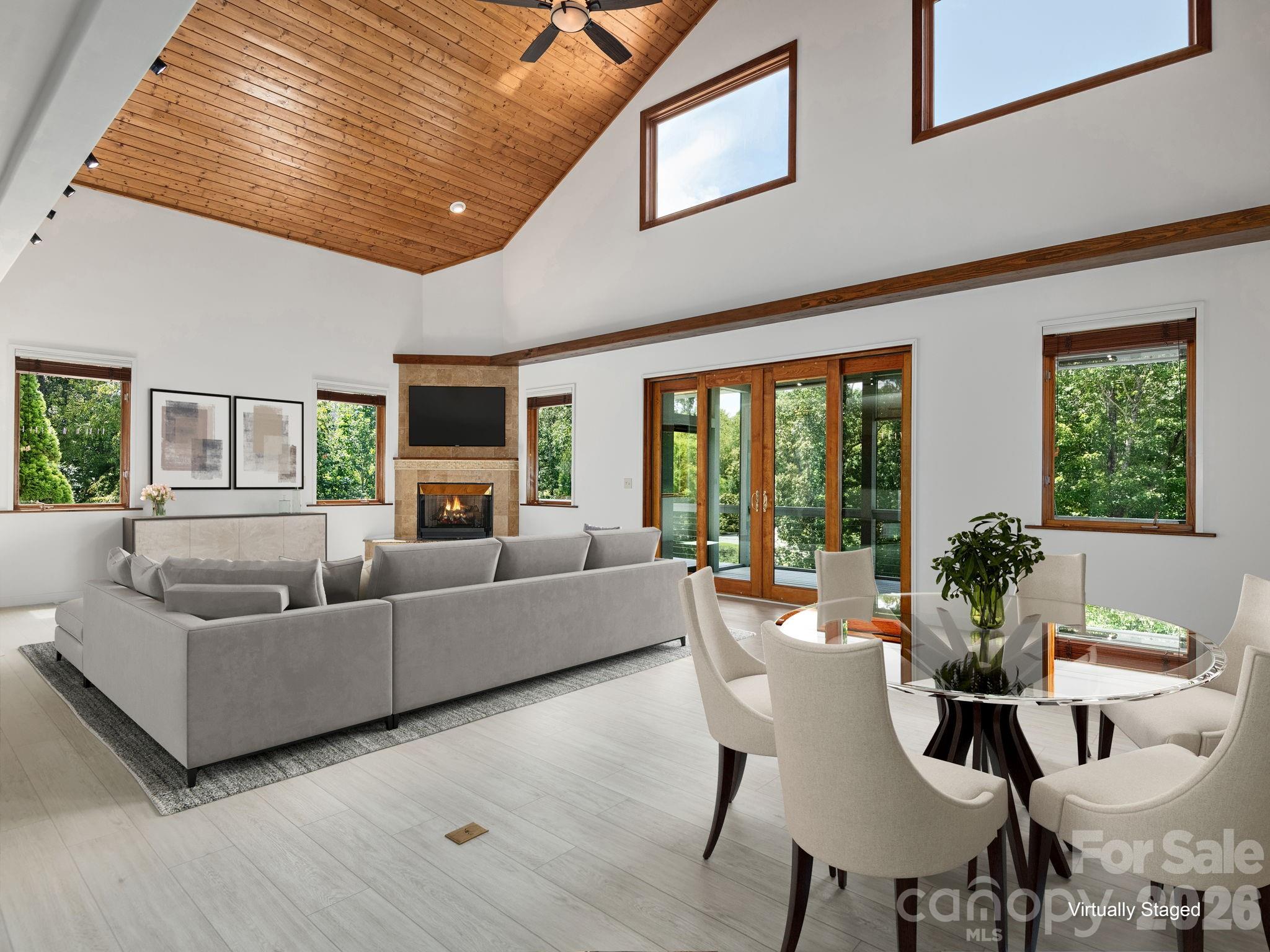 248 Wisdom Cove Road Flat Rock, NC 28731 - Photo 5 of 48 a living room with furniture and large windows