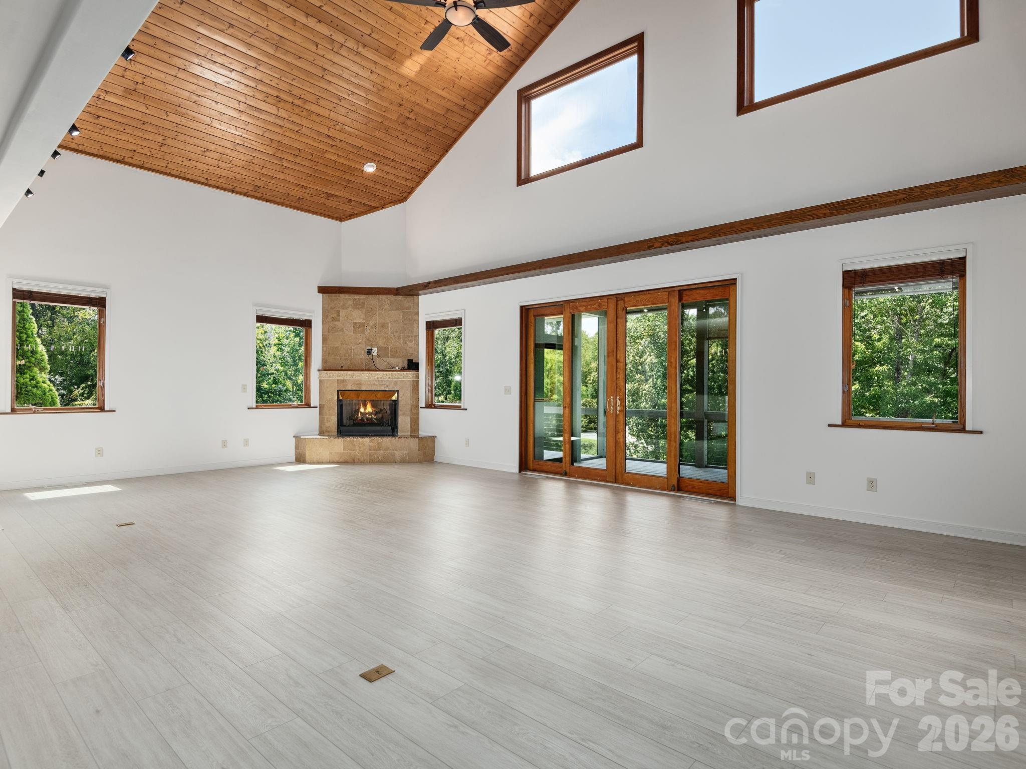 248 Wisdom Cove Road Flat Rock, NC 28731 - Photo 6 of 48 a view of an empty room with window and fire place