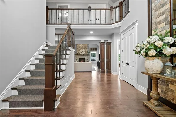 a large kitchen with stainless steel appliances kitchen island granite countertop a lot of counter space and a sink