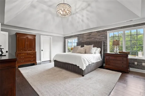 a room with furniture pool table and windows