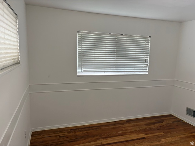 2313 150 East Bountiful, UT 84010 - Photo 16 of 39 Hardwood flooring in a room featuring multiple windows with blinds and decorative chair rail molding