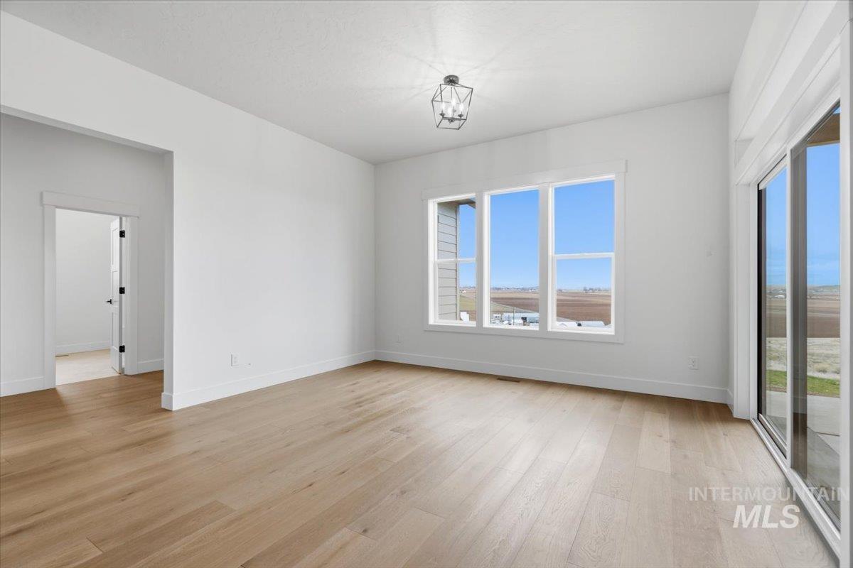 6431 Raptor Ridge Lane Melba, ID 83641 - Photo 23 of 50 Unfurnished room featuring light wood-type flooring and baseboards