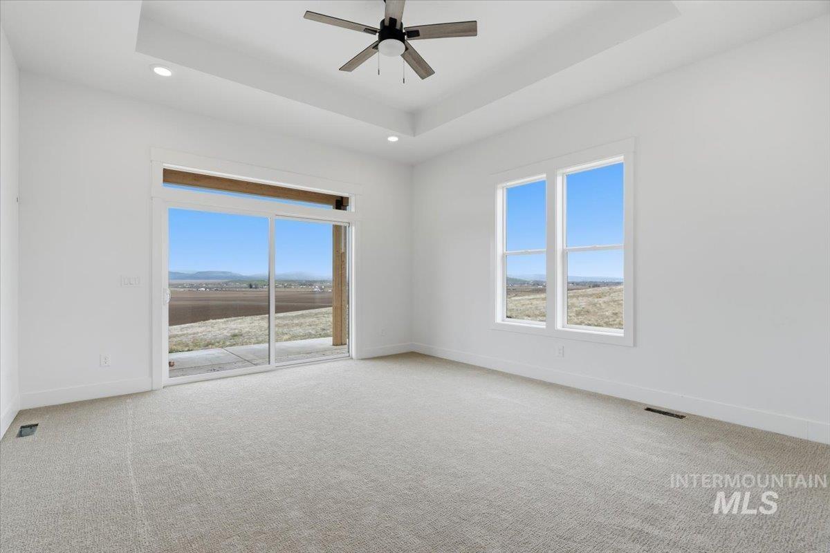 6431 Raptor Ridge Lane Melba, ID 83641 - Photo 25 of 50 Unfurnished room featuring a ceiling fan, light carpet, and recessed lighting