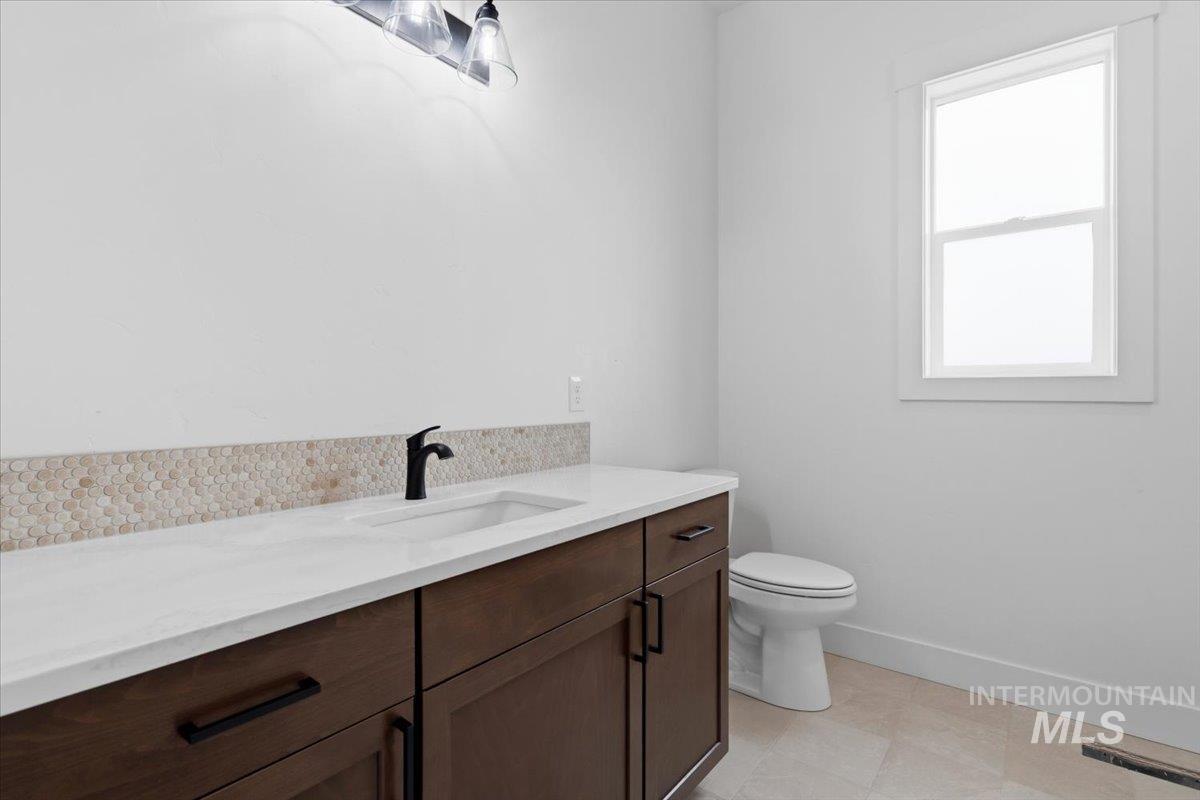 6431 Raptor Ridge Lane Melba, ID 83641 - Photo 46 of 50 Bathroom featuring vanity and toilet