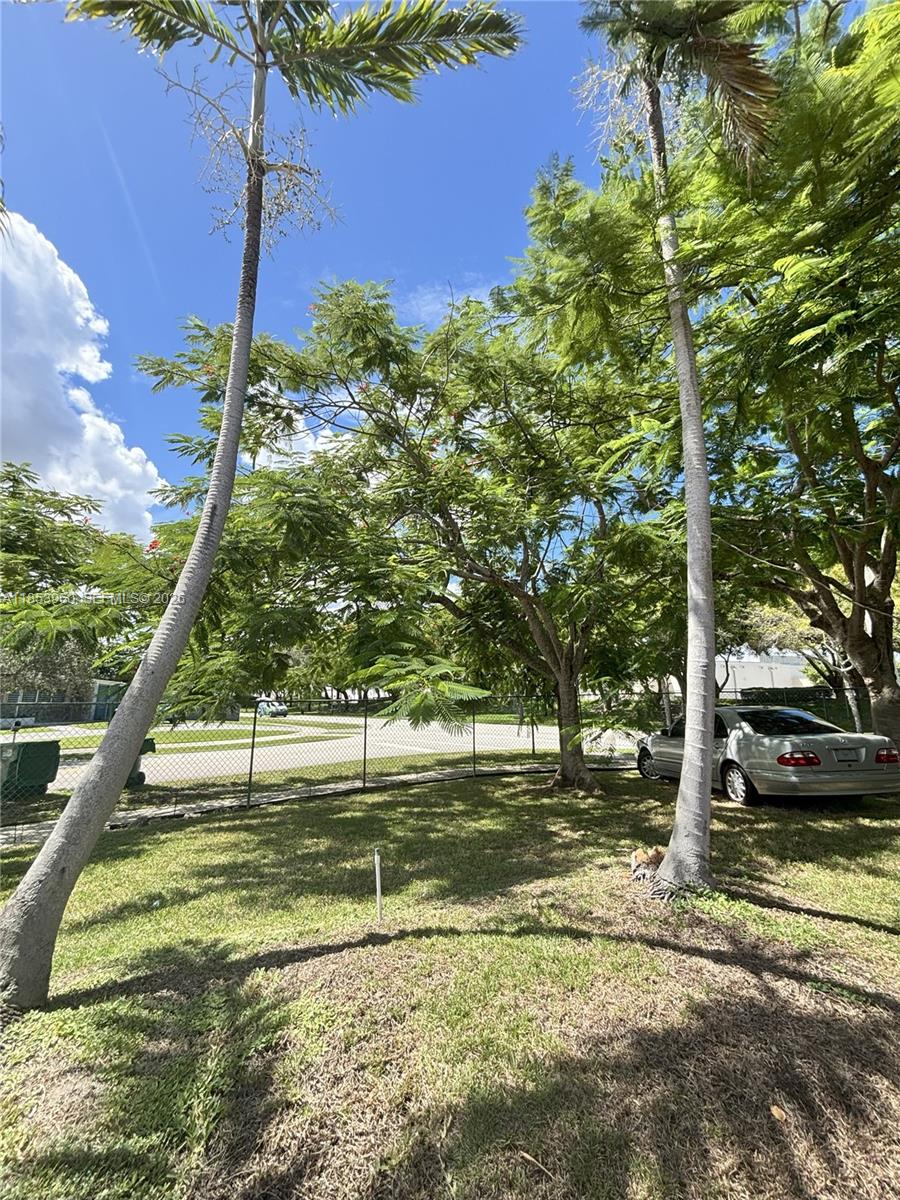 a view of a street with a building in the background