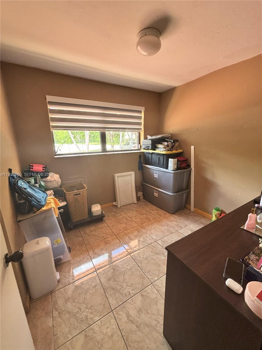 18601 Southwest 98th Avenue Cutler Bay, FL 33157 - Photo 12 of 28 a kitchen with a stove a refrigerator and a sink
