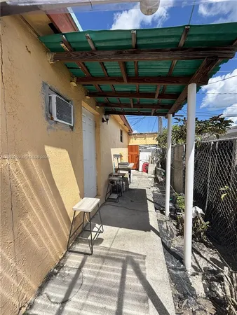 a view of a pathway along with potted plants