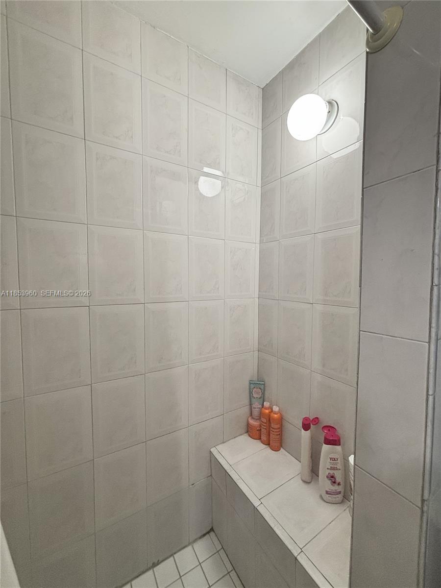 18601 Southwest 98th Avenue Cutler Bay, FL 33157 - Photo 15 of 28 a bathroom with a sink and a shower