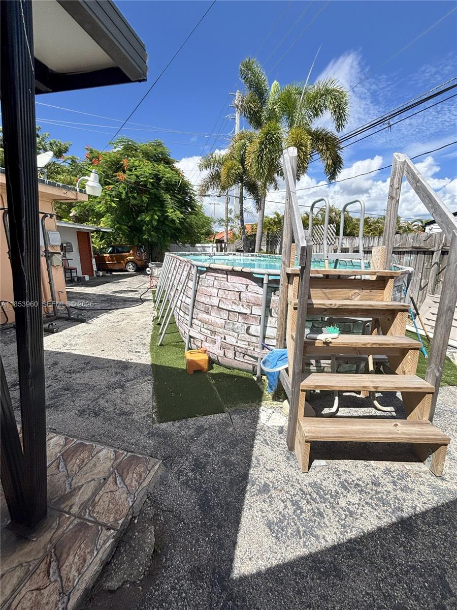 18601 Southwest 98th Avenue Cutler Bay, FL 33157 - Photo 21 of 28 a view of a porch with a yard