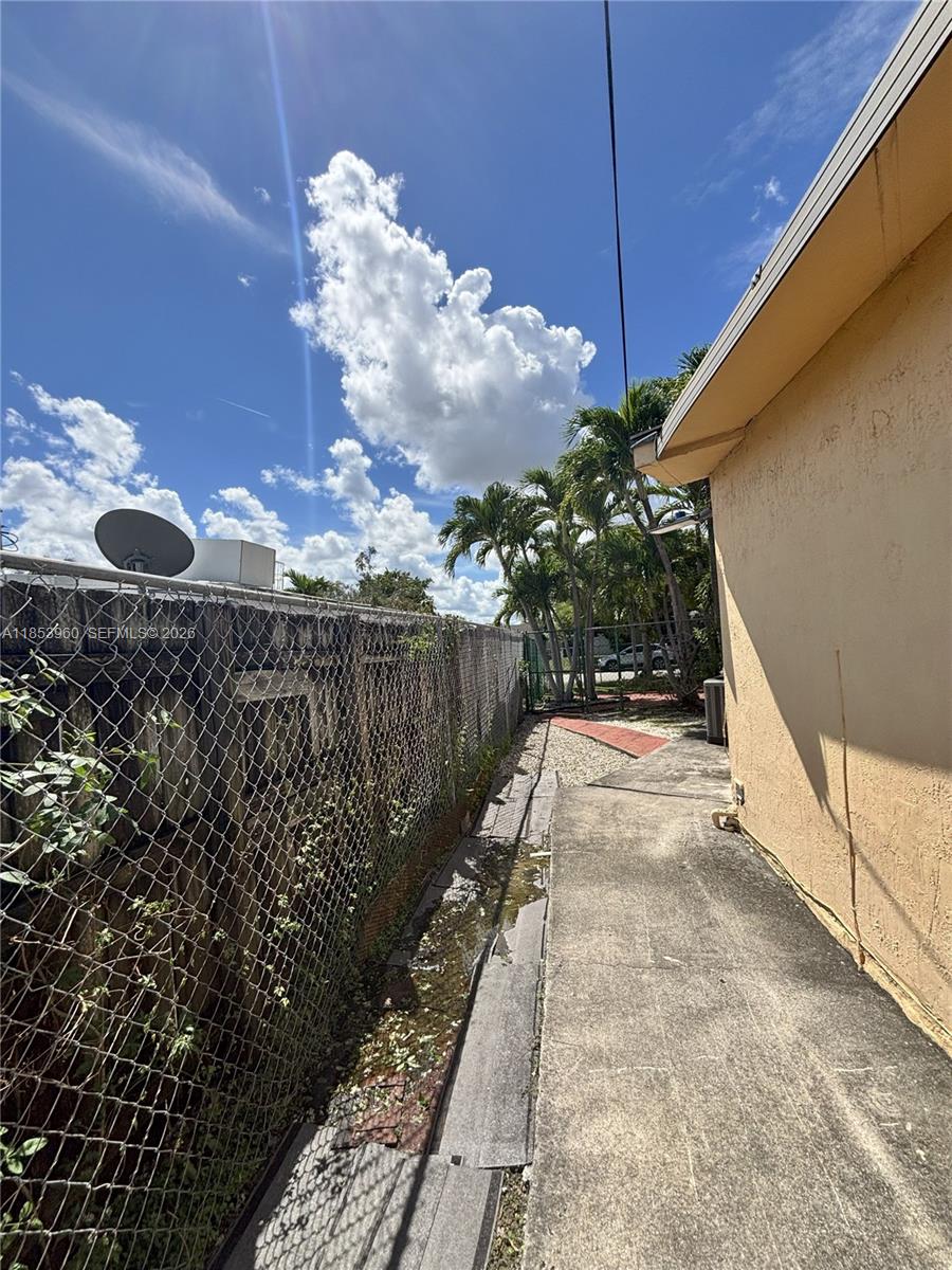 18601 Southwest 98th Avenue Cutler Bay, FL 33157 - Photo 26 of 28 a view of a pathway along with potted plants