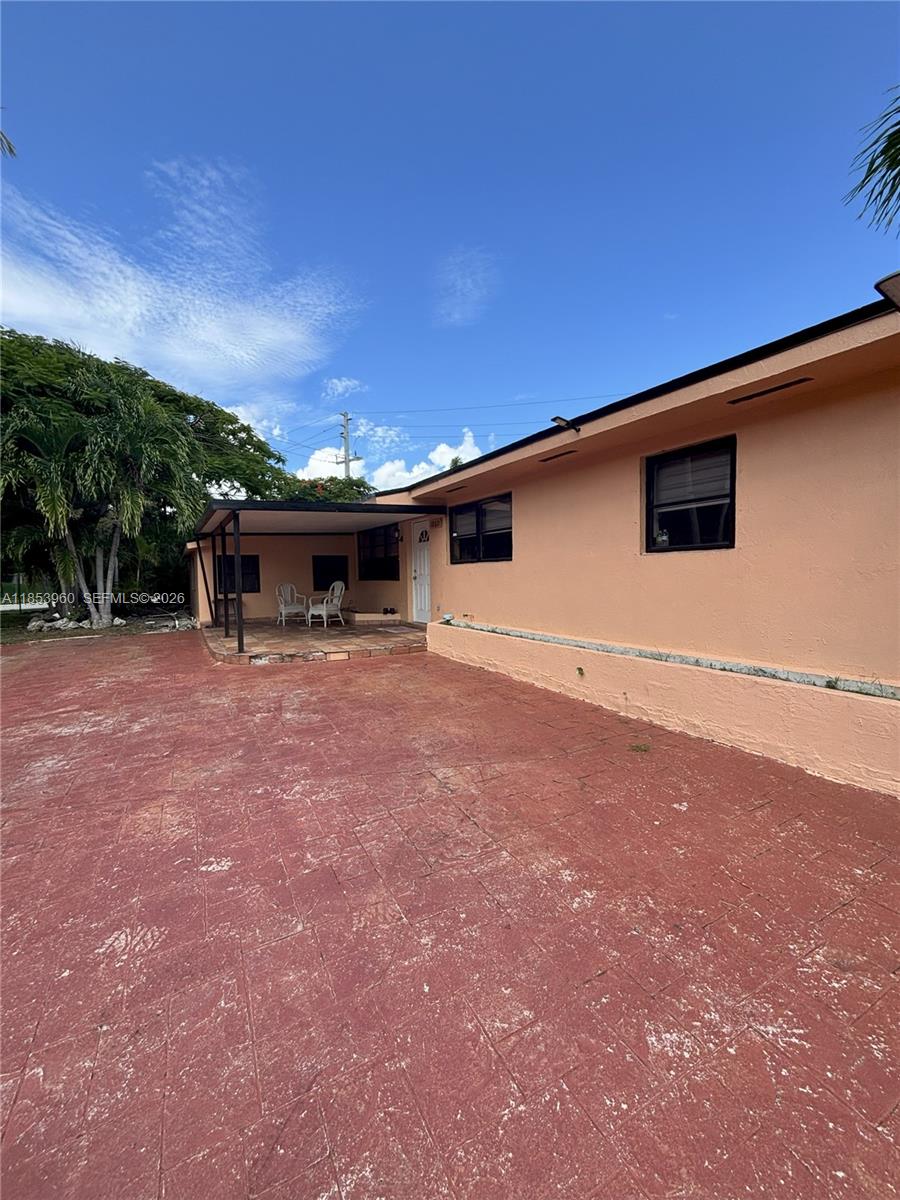 18601 Southwest 98th Avenue Cutler Bay, FL 33157 - Photo 3 of 28 a view of a house with a backyard