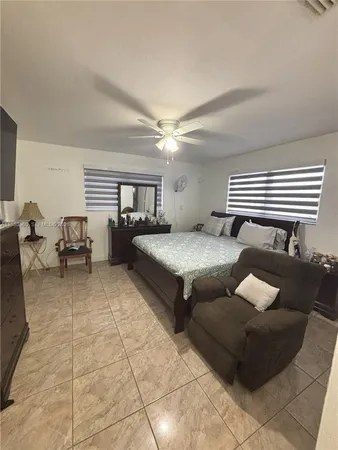 a living room with furniture and white walls