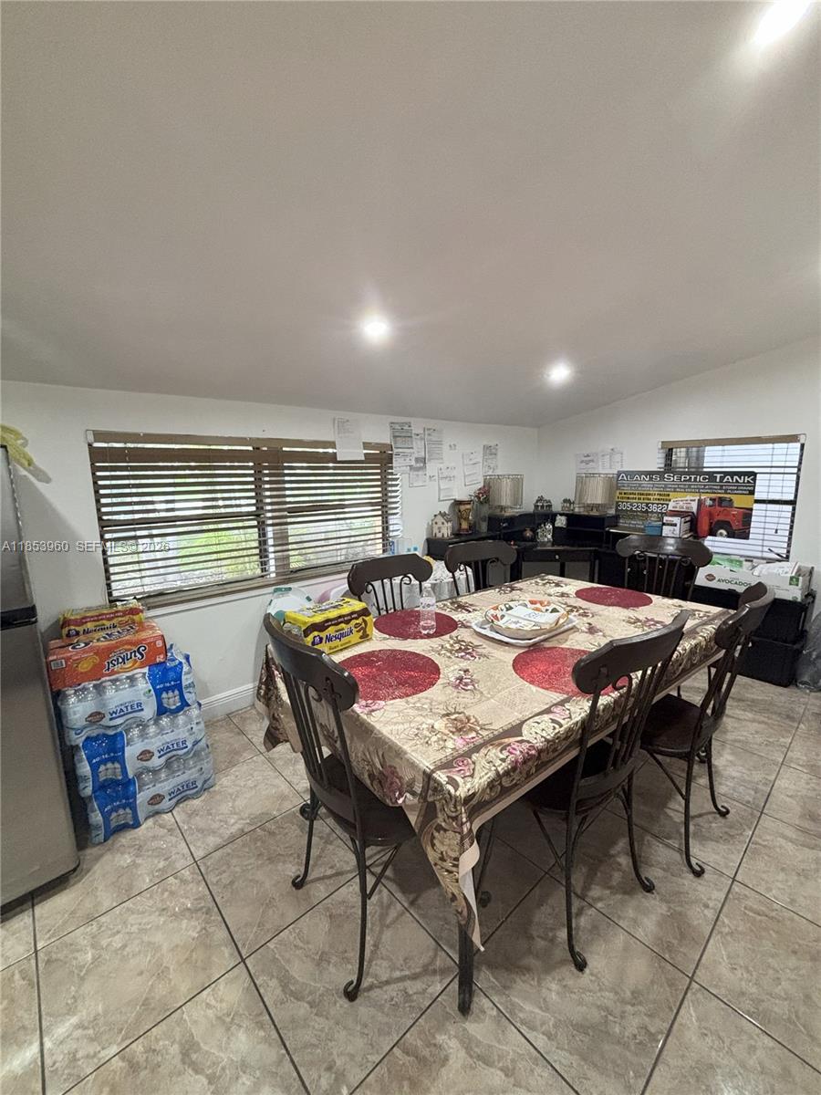 18601 Southwest 98th Avenue Cutler Bay, FL 33157 - Photo 8 of 28 a outdoor dining space with furniture and outdoor view