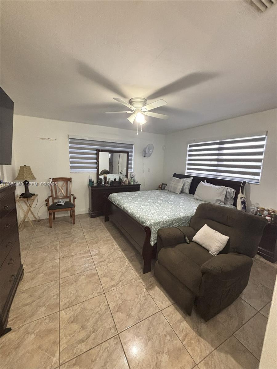 18601 Southwest 98th Avenue Cutler Bay, FL 33157 - Photo 10 of 28 a living room with furniture and white walls