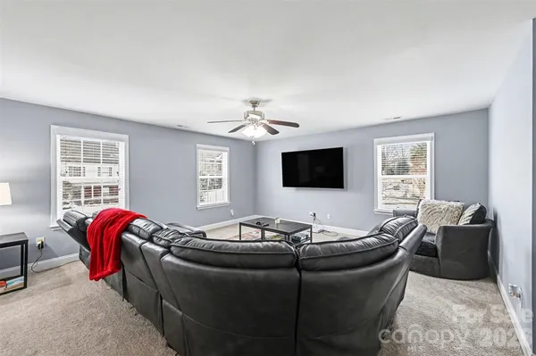 a bedroom with a large bed and a tv