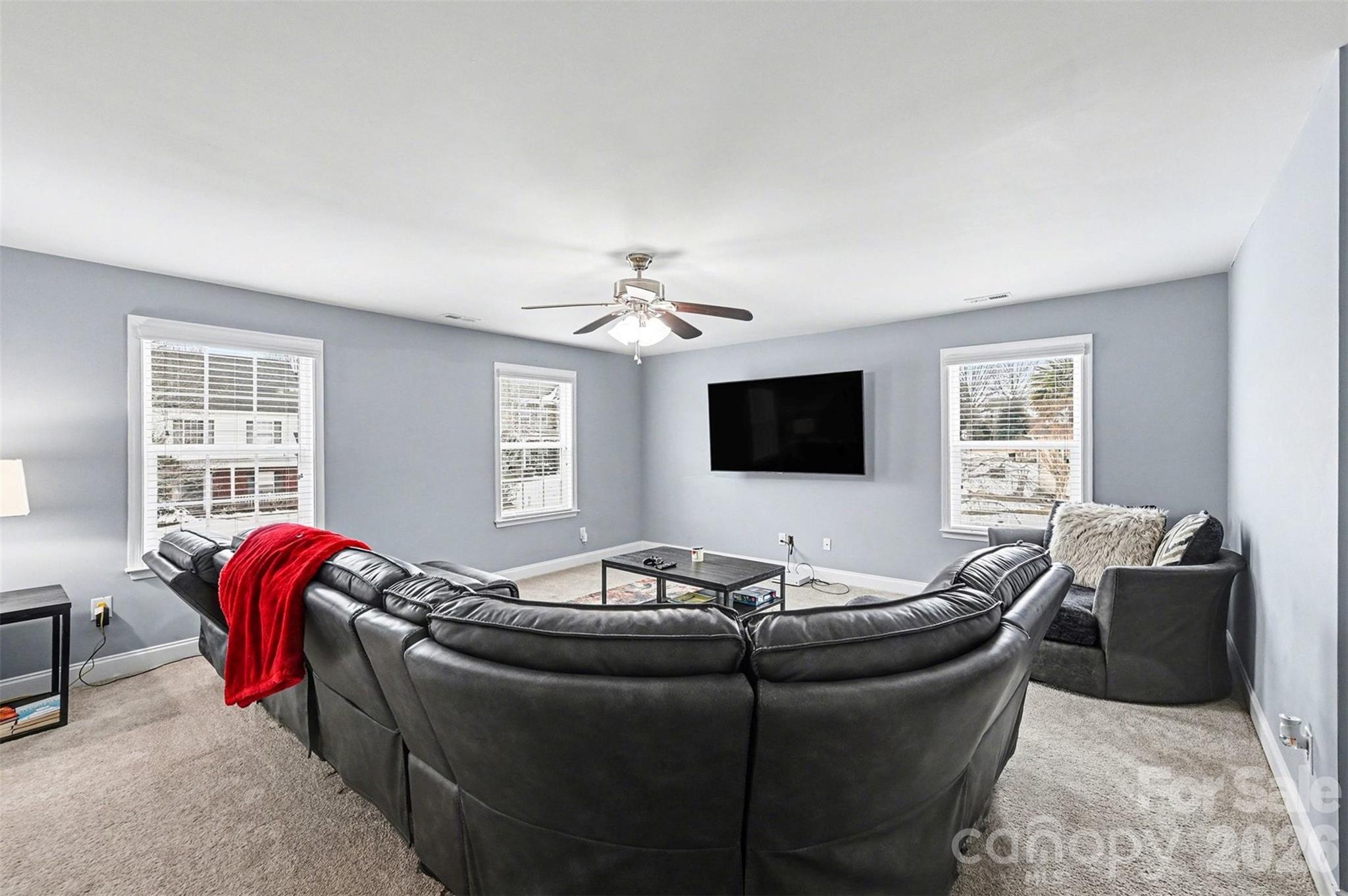 2213 Iron Works Drive Clover, SC 29710 - Photo 20 of 46 a living room with furniture and a flat screen tv
