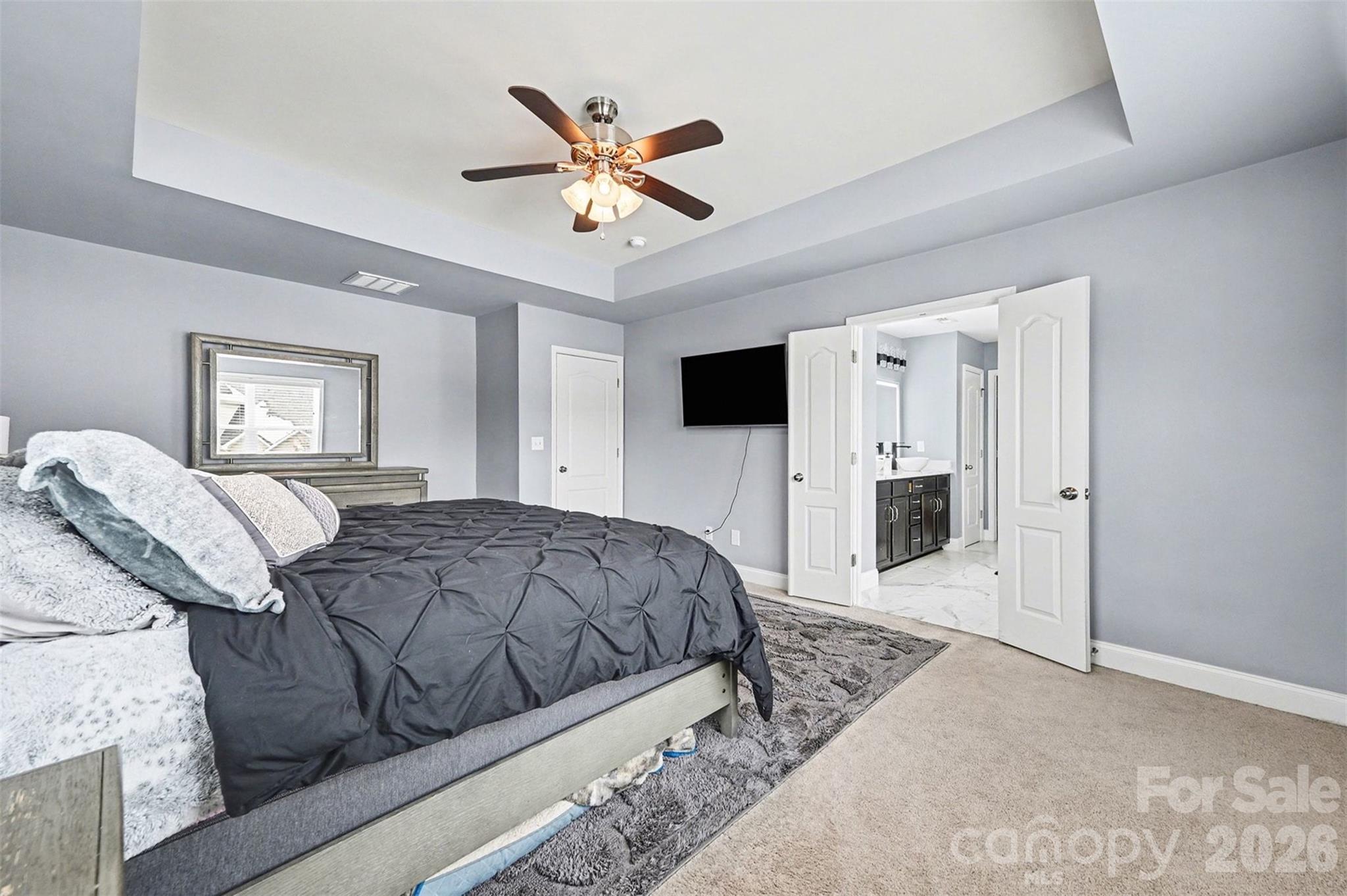 2213 Iron Works Drive Clover, SC 29710 - Photo 21 of 46 a bedroom with a large bed and a tv