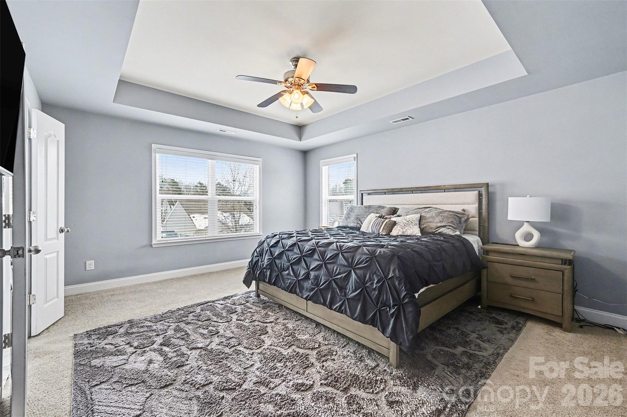 2213 Iron Works Drive Clover, SC 29710 - Photo 22 of 46 a bedroom with a bed lamp and a chandelier