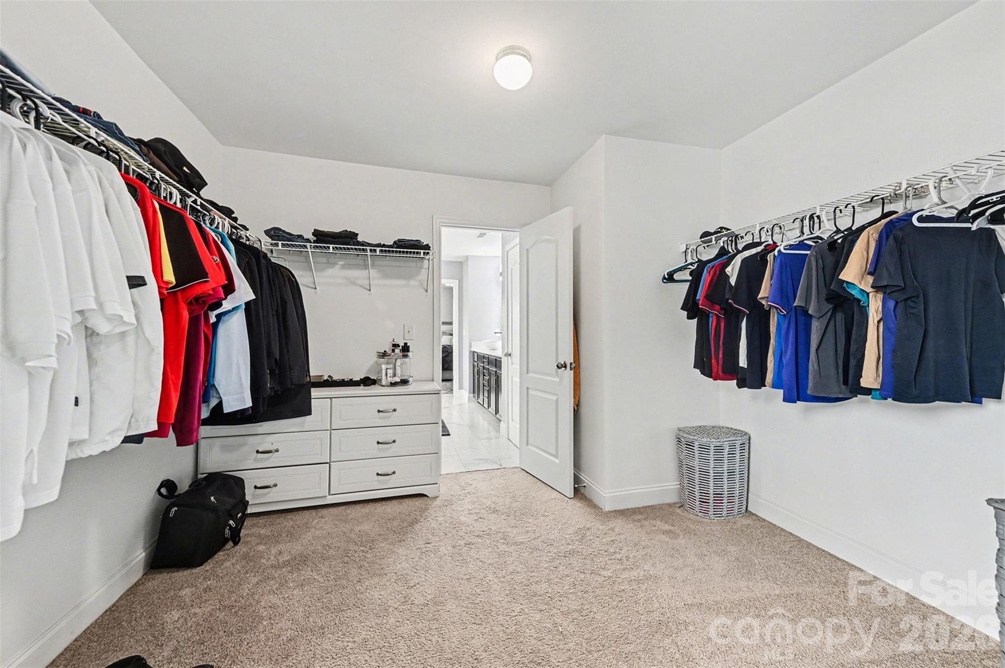 2213 Iron Works Drive Clover, SC 29710 - Photo 26 of 46 a view of walk in closet with clothes and shoes