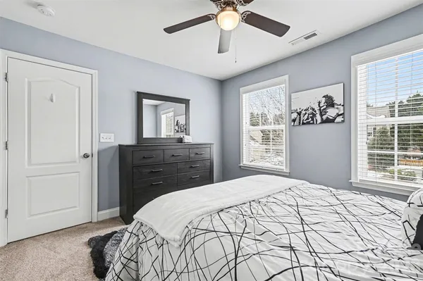 a bedroom with a bed and a table