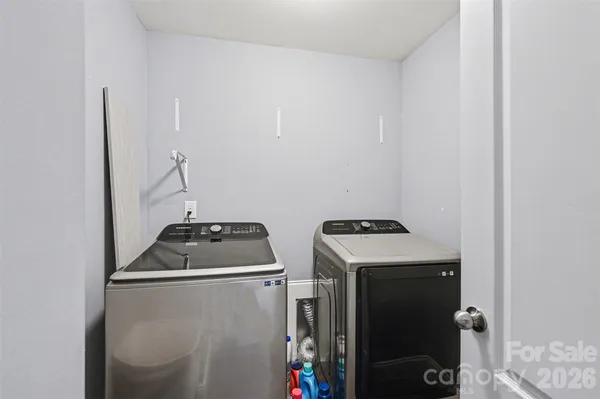 a view of a house with wooden deck