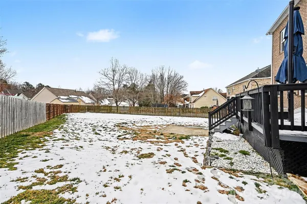 a view of a terrace with wooden fence