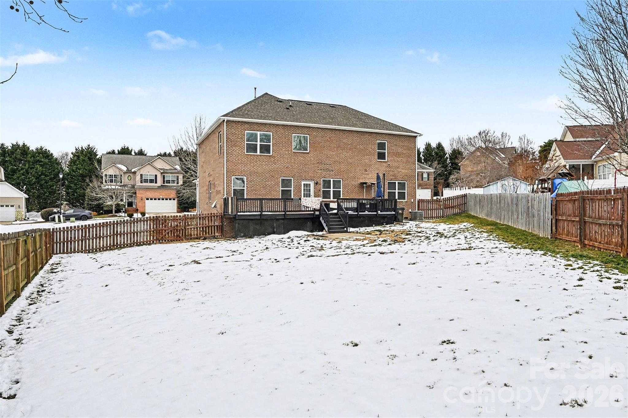 2213 Iron Works Drive Clover, SC 29710 - Photo 38 of 46 a view of a dry yard with snow in the background