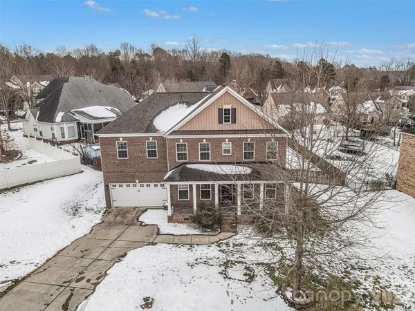 a view of a yard covered with snow