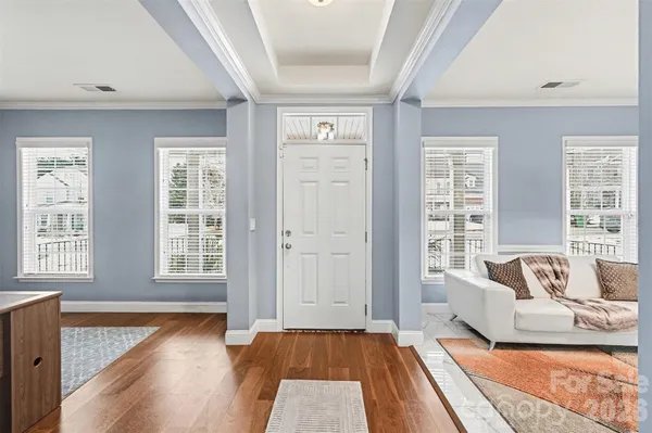 a living room with furniture and a rug