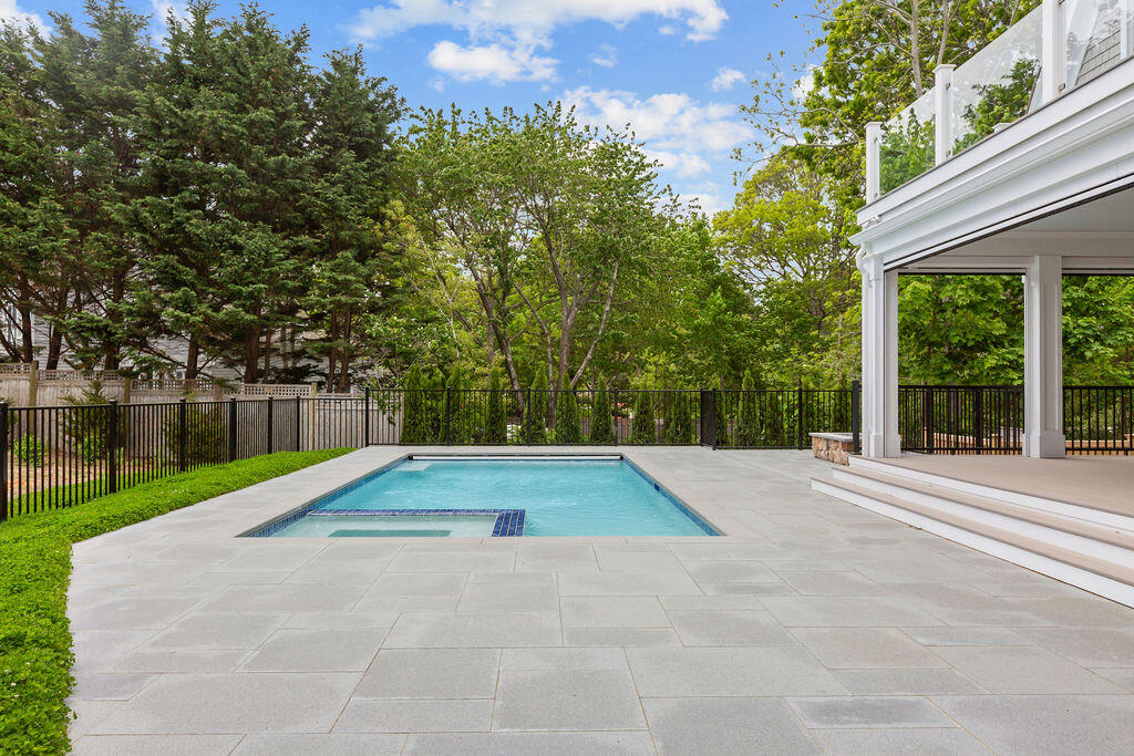 64 Pershing Lane Orleans, MA 02653 - Photo 21 of 100 a white house with a yard and large trees