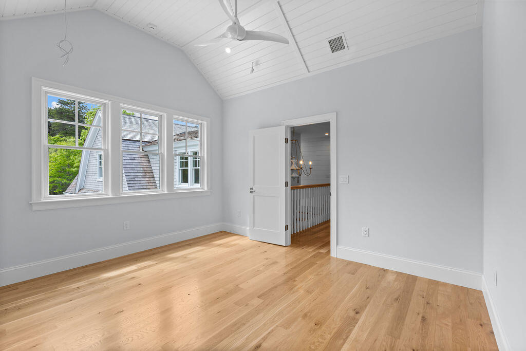 64 Pershing Lane Orleans, MA 02653 - Photo 70 of 100 wooden floor in an empty room with a window