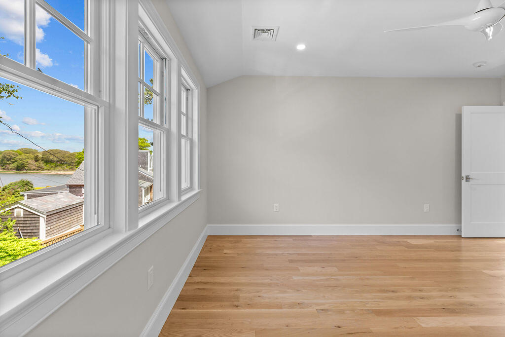 64 Pershing Lane Orleans, MA 02653 - Photo 77 of 100 a view of an empty room with a window