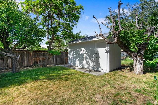 432 Calnette Drive Sandy, UT 84070 - Photo 45 of 48 Outdoor storage shed featuring white siding and a shingle roof