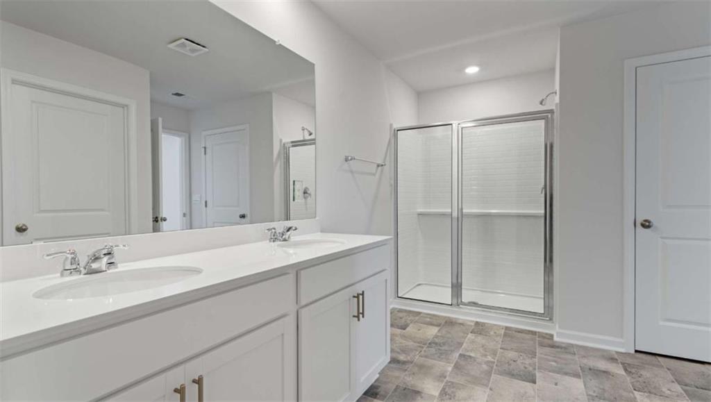 6062 Knickerbocker Street Mableton, GA 30126 - Photo 11 of 11 a bathroom with a granite countertop sink and a mirror