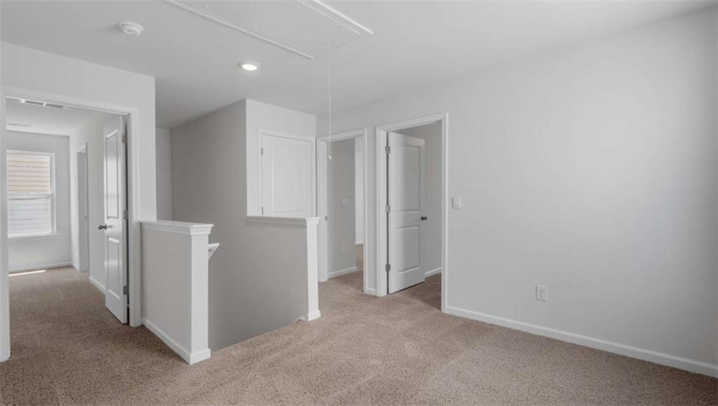 6062 Knickerbocker Street Mableton, GA 30126 - Photo 4 of 11 an empty room with a bathroom